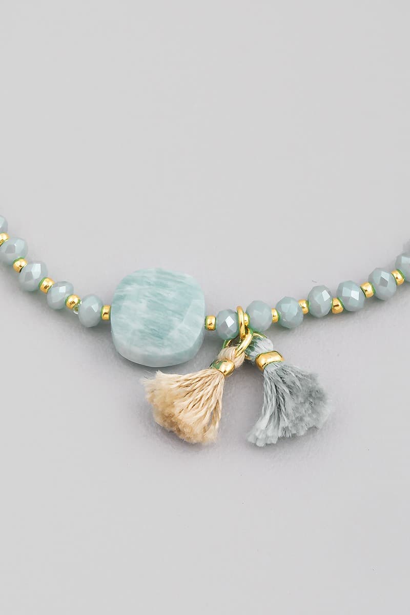 GLASS STONE AND TASSEL STRETCH BRACELET