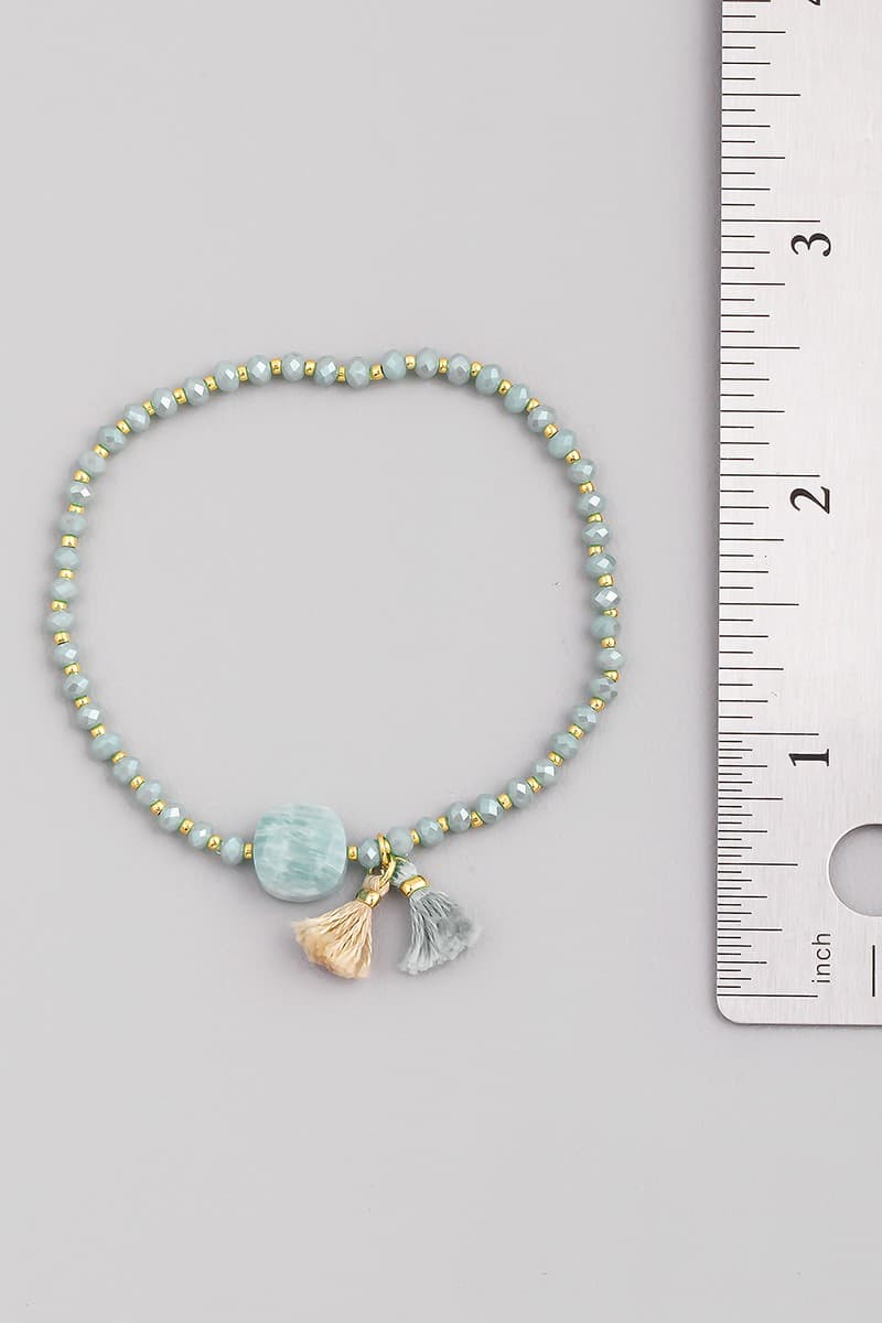 GLASS STONE AND TASSEL STRETCH BRACELET