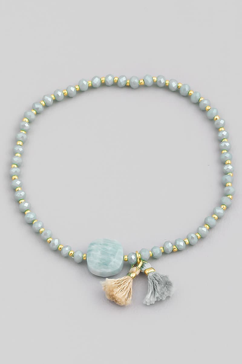 GLASS STONE AND TASSEL STRETCH BRACELET