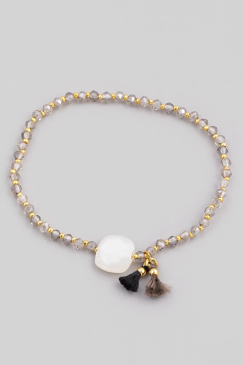 GLASS STONE AND TASSEL STRETCH BRACELET