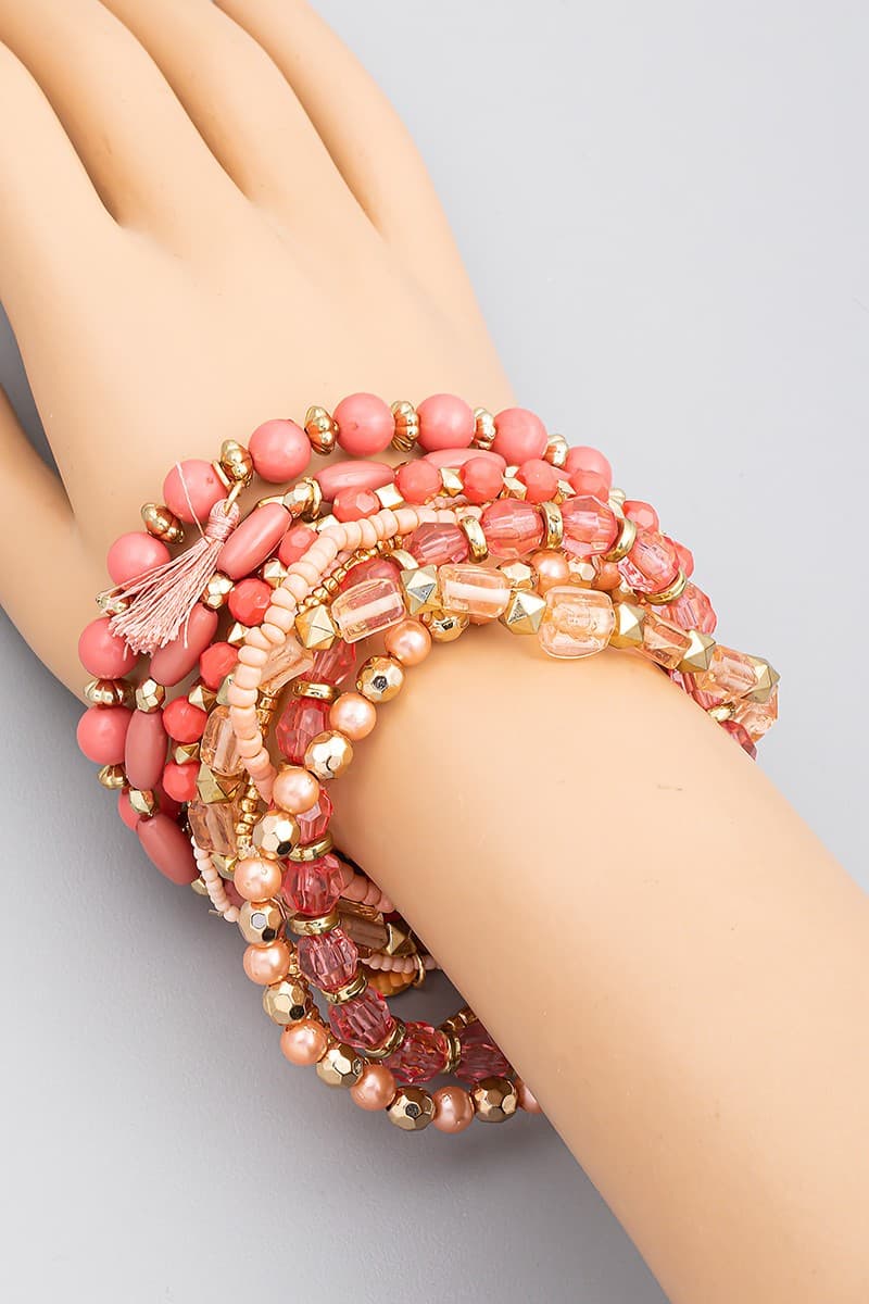 PINK MULTI ROW STRETCH BRACELET WITH TASSEL