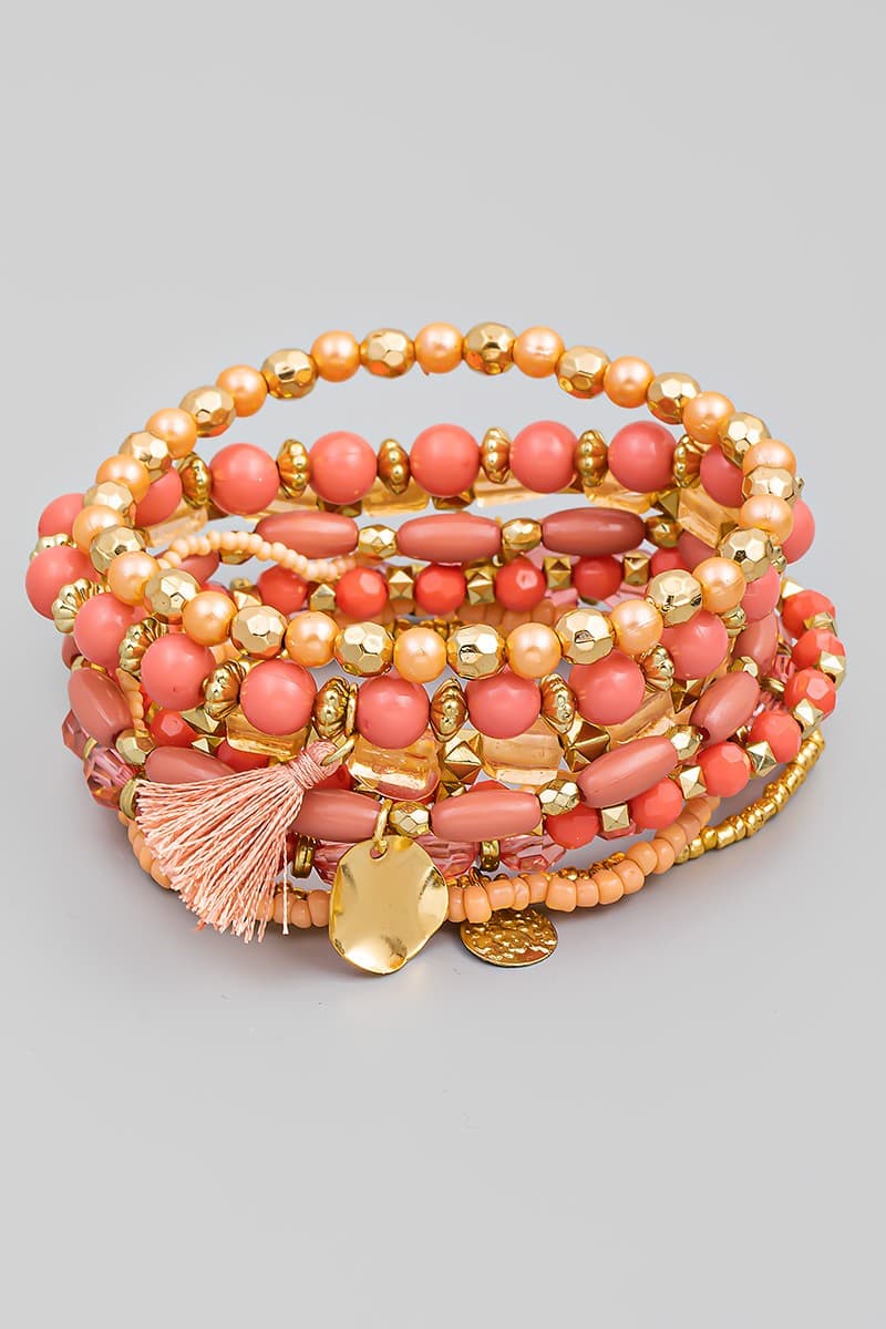 PINK MULTI ROW STRETCH BRACELET WITH TASSEL