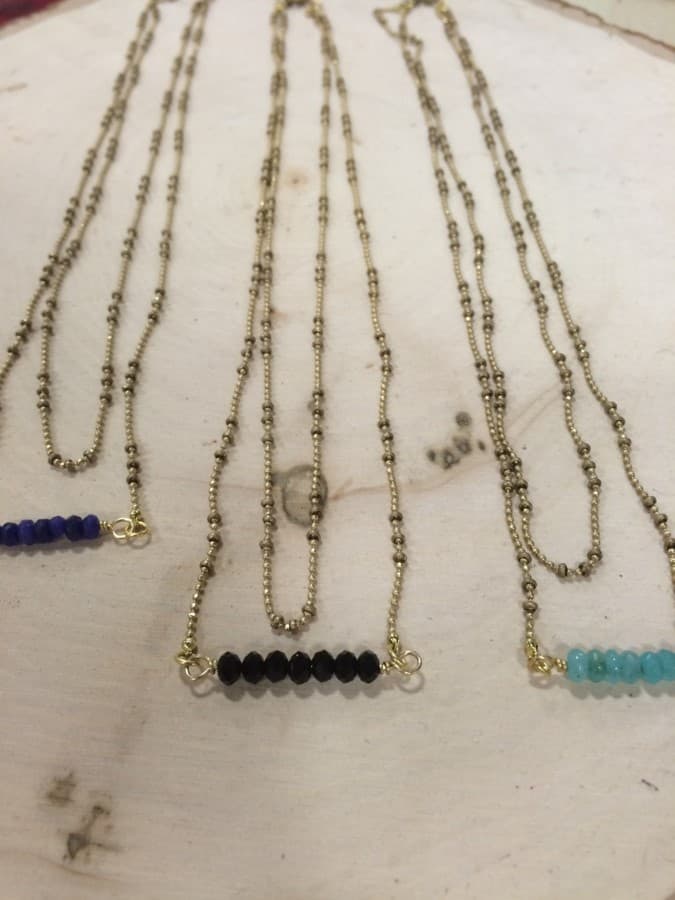 GLASS BEAD NECKLACE WITH CRYSTAL PENDENT